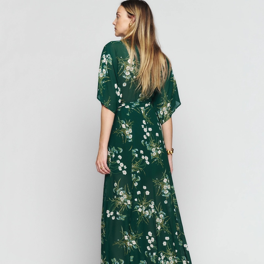 Brand new. Brought it for a wedding but ended up going with another dress.